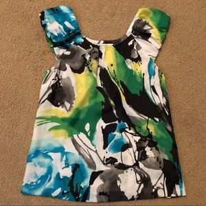 Brightly colored, sleeveless blouse
